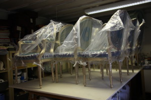 dining chairs ready to leave the workroom - all wrapped in plastic !